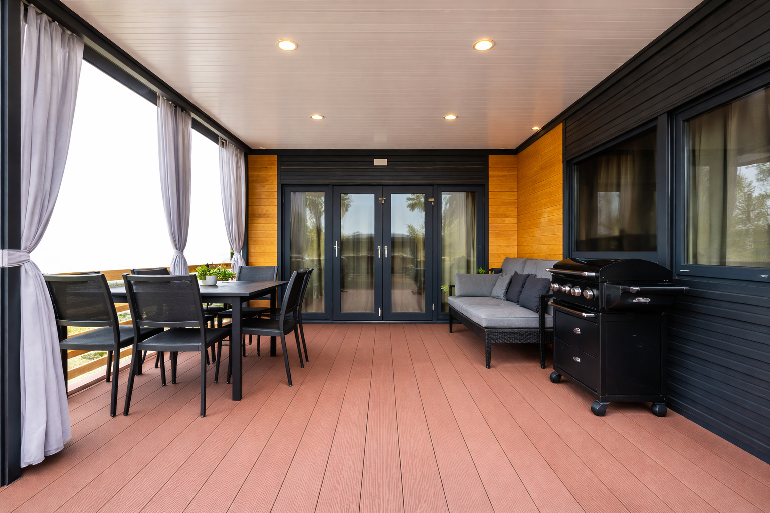 Terasă modernă cu mobilier și grătar